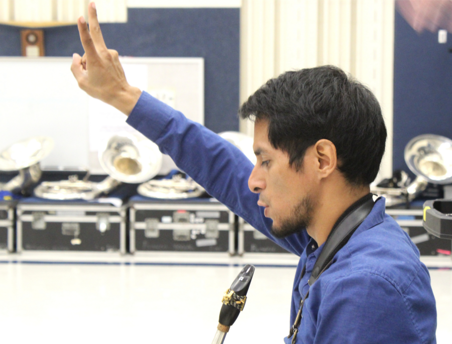Assistant Band Director Jesus Bermeo reminds the band to play a repeat during fifth period band class.
