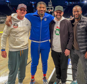 Assistant Coach Kenny Boren, at left, poses with NBA player Marcus Smart. (Photo courtesy of Kenny Boren)