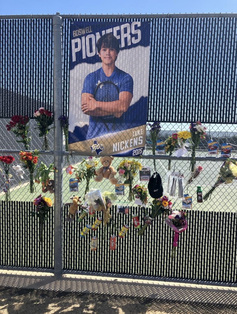 The tennis team put up a temporary memorial to senior Luke Nickens, who died March 18 while kayaking.