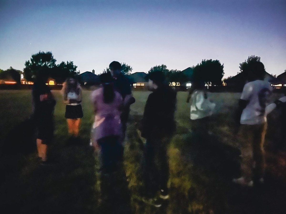 Astronomy club members gather at twilight at the club's Oct. 20 star party. Junior Chloe Bullock was exceited about this new tradition. "I'm just excited to look at the stars," Bullock said.